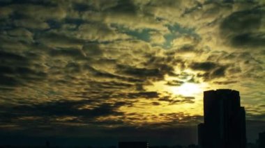 Video of the sky, clouds, towns and buildings, from daytime to sunset