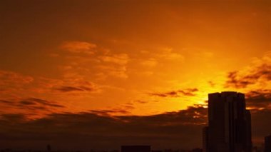 Video of the sky, clouds, towns and buildings, from daytime to sunset