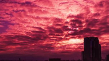 Video of the sky, clouds, towns and buildings, from daytime to sunset