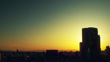 Video of the sky, clouds, towns and buildings, from daytime to sunset