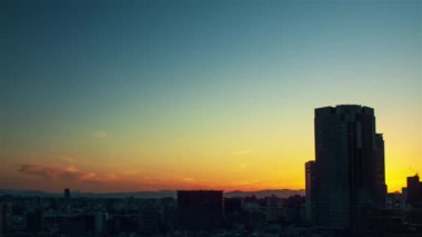 Video of sky, clouds, city and buildings, night view from sunset