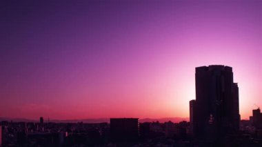 Video of the sky, clouds, towns and buildings, from daytime to sunset