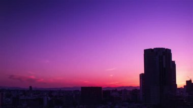 Video of sky, clouds, city and buildings, night view from sunset