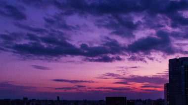 Video of sky, clouds, city and buildings, night view from sunset