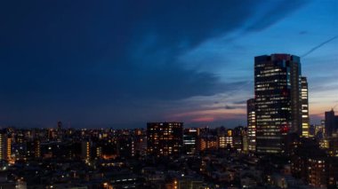 Video of sky, clouds, city and buildings, night view from sunset