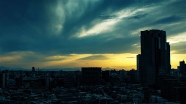 Video of the sky, clouds, towns and buildings, from daytime to sunset