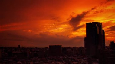 Video of the sky, clouds, towns and buildings, from daytime to sunset
