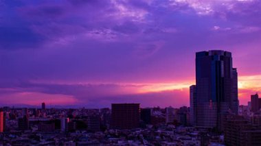 Video of the sky, clouds, towns and buildings, from daytime to sunset