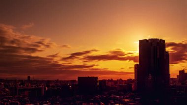 Video of the sky, clouds, towns and buildings, from daytime to sunset