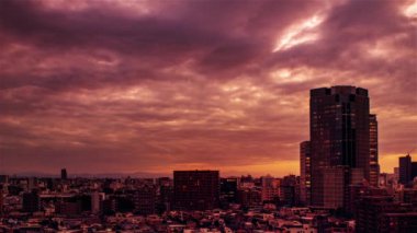 Video of sky, clouds, city and buildings, night view from sunset