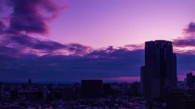 Video of sky, clouds, city and buildings, night view from sunset