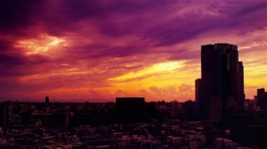 Video of the sky, clouds, towns and buildings, from daytime to sunset