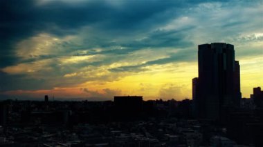 Video of the sky, clouds, towns and buildings, from daytime to sunset