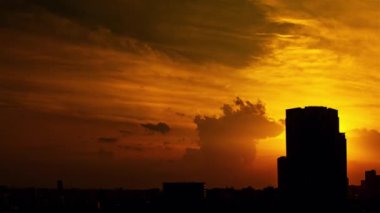 Video of the sky, clouds, towns and buildings, from daytime to sunset