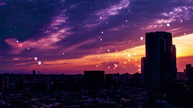 Gün batımında gökyüzünde dans eden grafikli resim