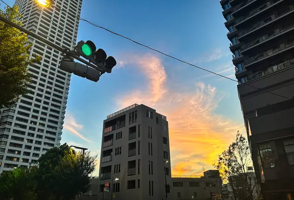 stock image Urban high-rise apartments, traffic lights and sky, evening