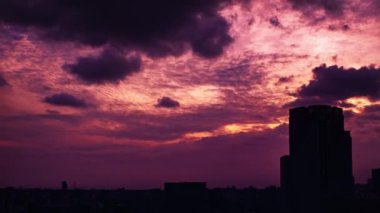 Video of sky, clouds, city and buildings, night view from sunset