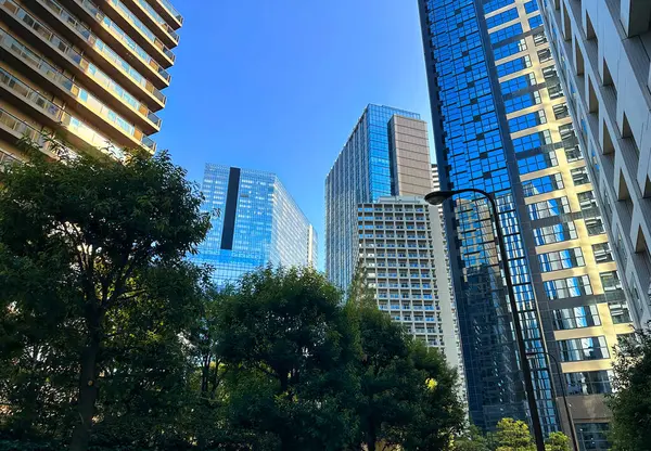 stock image High-rise apartment building in the city and blue sky, daytime, looking up