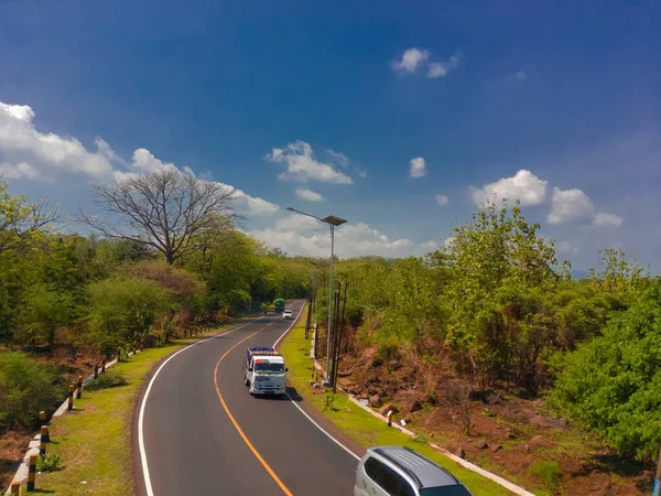 stock image Aerial shot of road between the forests in National Park Situbondo, East Java