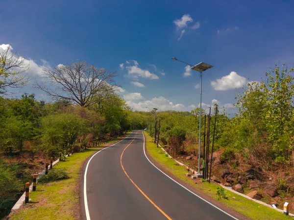 stock image Aerial shot of road between the forests in National Park Situbondo, East Java