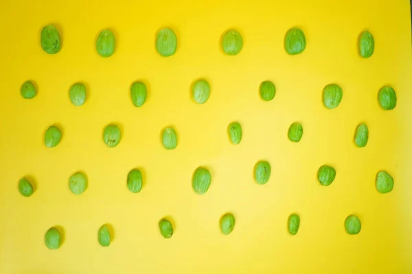 stock image Petai known as stink bean with yellow background isolated