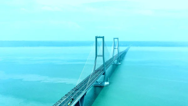 stock image November 21, 2022. Aerial view of Suramadu bridge in the foggy afternoon in Surabaya, Indonesia