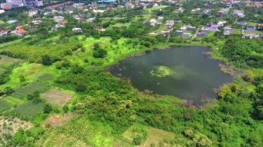 Aerial view of lake banyu mumbul in Menganti, Gresik, Indonesia. Drone footage.