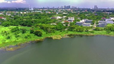 Aerial view of lake banyu mumbul in Menganti, Gresik, Indonesia. Drone footage.