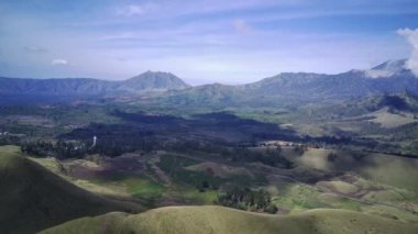 Aerial view of Kawah Wurung grass lands in Bondowoso, East Java. Indonesia. Drone footage.