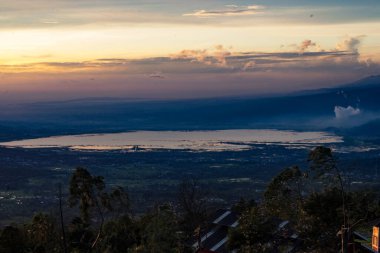 The landscape sunrise of the Rawapening against Merbabu Mountain in Central Java, Indonesia. Long exposure photography.
