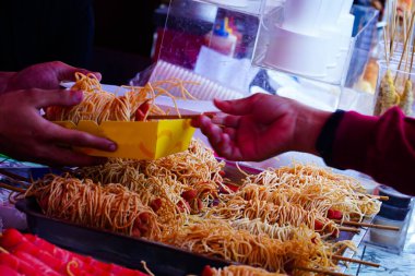 Street foods displays around Sam Poo Kong Temple. Semarang. Indonesia. In Chinese New Year 2023. Street Photography.