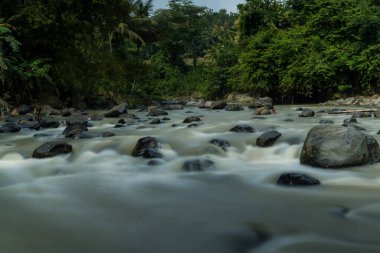 Rocky river stream of Kali Bojong, Salatiga, Central Java. Indonesia. Long Exposure Photography. Blurred motions.