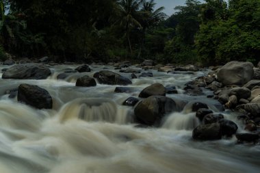 Rocky river stream of Kali Bojong, Salatiga, Central Java. Indonesia. Long Exposure Photography. Blurred motions.