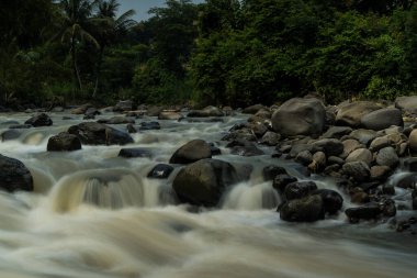Rocky river stream of Kali Bojong, Salatiga, Central Java. Indonesia. Long Exposure Photography. Blurred motions.