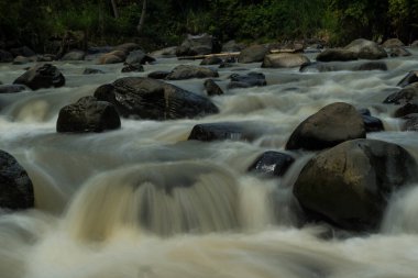 Rocky river stream of Kali Bojong, Salatiga, Central Java. Indonesia. Long Exposure Photography. Blurred motions.