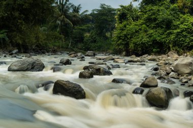Rocky river stream of Kali Bojong, Salatiga, Central Java. Indonesia. Long Exposure Photography. Blurred motions.