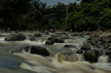Rocky river stream of Kali Bojong, Salatiga, Central Java. Indonesia. Long Exposure Photography. Blurred motions.