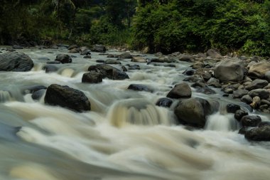 Rocky river stream of Kali Bojong, Salatiga, Central Java. Indonesia. Long Exposure Photography. Blurred motions.