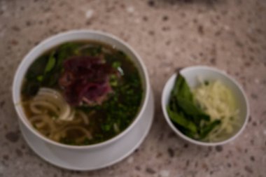 Close up of Vietnamese pho soup with beef, meatball, fresh vegetable. Food Photography.