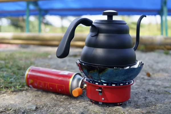 stock image Black Drip kettle on portable stove for camping. Park and outdoor photography.