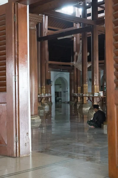 stock image July 8, 2023. eople praying, reading Al Qur'an, chatting, sleeping inside Mesjid Sunan Ample or Sunan Ample Mosque in Surabaya, Indonesia.