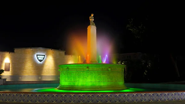 stock image Beverly Hills, California - October 11, 2019: BEVERLY HILLS ELECTRIC FOUNTAN by Night. Located on the corner of Santa Monica Blvd and Wilshire Boulevard