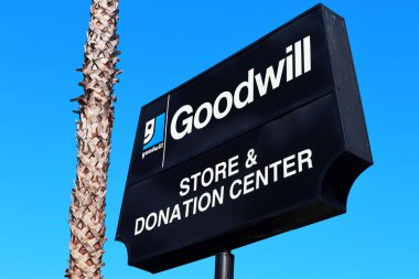 Los Angeles, California - October 10, 2019: Goodwill Store & Donation Center. American nonprofit organization of vocational rehabilitation for disabled persons clipart
