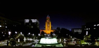 Los Angeles, California  May 14, 2019: view of City Hall from the Fountain of Grand Park located in the Civic Center of Los Angeles clipart