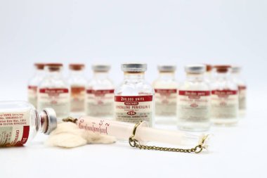 Pescara, Italy - March 27, 2019: Vintage 1951 Vials of PENICILLIN G Produced by CSC Pharmaceuticals division of Commercial Solvents Corporation, New York, USA clipart