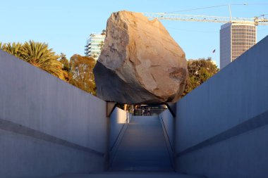 Los Angeles, California - October 13, 2023: Public Art LEVITATED MASS a sculpture by Michael Heizer at the LACMA, Los Angeles County Museum of Art clipart