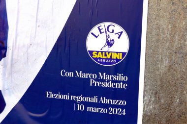Abruzzo, Italy - March 3, 2024: Detail of Election Wall Poster for the ABRUZZO Regional Election of March 10, 2024 with symbol of LEGA Salvini Political Party clipart
