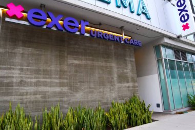 Los Angeles, California - July 20, 2024: EXER Urgent Care, clinic with experienced emergency room doctors, a range of services including on-site X-rays, labs, pharmacy, IV, splinting, laceration care clipart