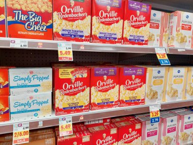 Los Angeles, California - July 21, 2024: Different boxes of Popcorn on a shelf in a supermarket clipart