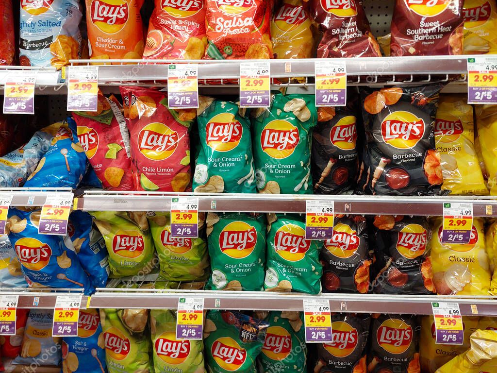 Los Angeles, California - July 21, 2024: bags of different flavors of LAY'S on a shelf in a supermarket